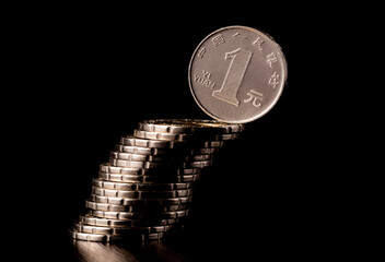 A coin of 1 Chinese yuan on a black background