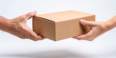 Two hands exchanging a plain cardboard box, symbolizing delivery, sharing, or gifting.