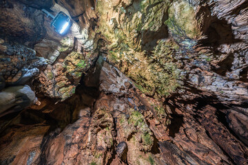 Cave ceiling with stalactites and growth