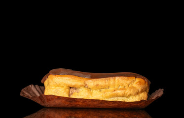 Chocolate sweet eclair, macro, isolated on black  background.