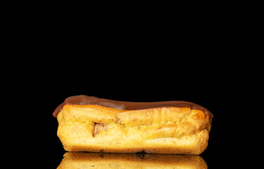Chocolate sweet eclair, macro, isolated on black  background.