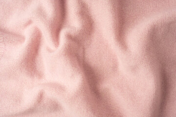 Fototapeta premium Soft pink cashmere sweater texture background.