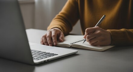 Person Writing in Notebook.