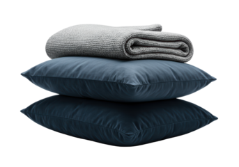 Isolated stack of dark pillows and a folded knitted blanket for the bed or sofa decor