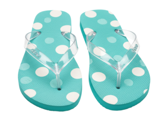 Isolated summer beach flip-flops with turquoise blue polka dot footbed and clear straps