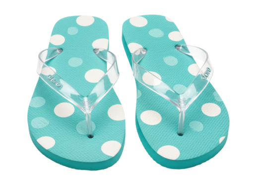 Isolated summer beach flip-flops with turquoise blue polka dot footbed and clear straps