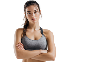 Confident woman in sportswear with arms crossed, isolated on white background.