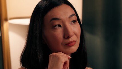 Adult pensive thinking decision think pondering doubtful Asian woman Korean female Chinese lady...