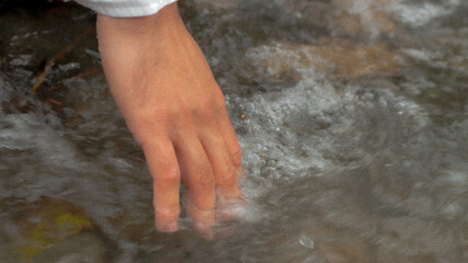 water flowing into the hands