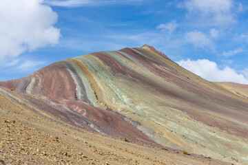 Cerro Vinicunca Rainbow mountain or Seven color mountain in Peru, Cusco. Colored stones and soil in the mountain valley. Red valley and Rainbow mountain view point popular tourist destination