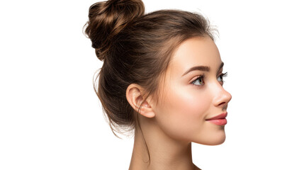 Fototapeta premium Profile view of a young woman with a bun hairstyle against a white background.