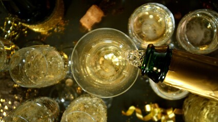 Freeze motion of pouring champagne into flute. Concept of celebration and success.