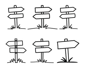 Collection of doodle direction signs with arrow shapes and grassy ground against a white background