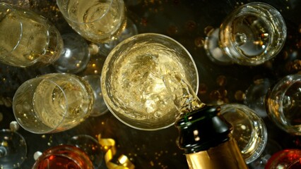 Freeze motion of pouring champagne into flute. Concept of celebration and success.