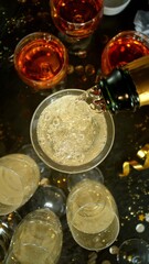 Freeze motion of pouring champagne into flute. Concept of celebration and success.
