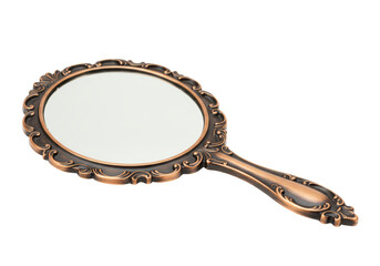 Isolated vintage handheld mirror with decorative bronze frame on seamless backdrop