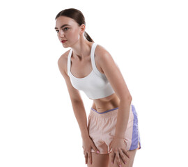 Woman doing abdominal vacuum exercise on white background