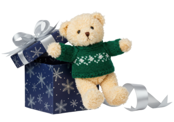 Isolated teddy bear with snowflake sweater peeking out of navy gift box with silver bow tie