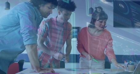 Collaborating team members analyzing data at meeting room table, with laptop charts overlay