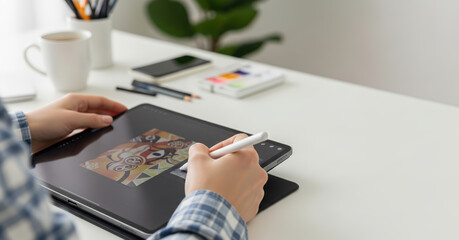 Graphic Designer Sketching on Digital Tablet