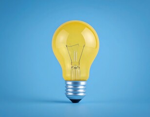 Illuminated yellow light bulb on a solid blue background