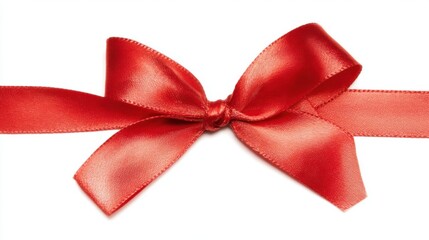 A silky red bow made from smooth fabric material with symmetrical tails and fringed ends,
