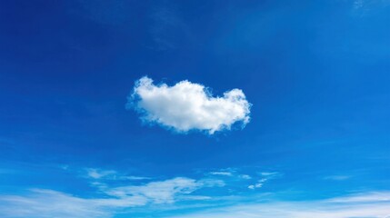 A clear blue sky with a bright white cloud prominently positioned near the center, serene and peaceful atmosphere.