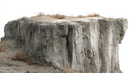 Cliff edge with dry grass isolated on white background, a rugged and natural formation with weathered texture