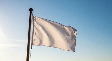 White Flag Waving in Blue Sky.