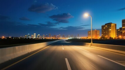 Obraz premium Nighttime city highway with illuminated streetlights and urban skyline in the distance