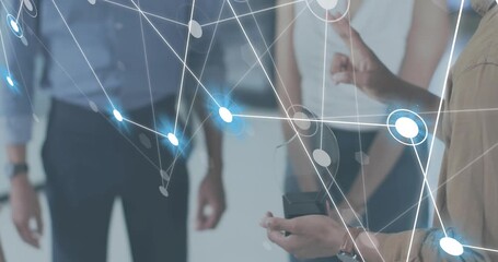 Presenter lifting AR headset and expanding holographic network for tech demo, team observing - Powered by Adobe