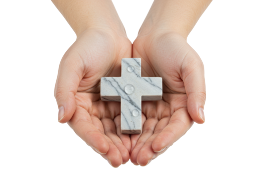Isolated marble cross resting in cupped human hands offering hope spirituality faith