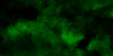 Abstract black background with green smokes. Dark green powder explosion on black background. Grungy dark canvas background.	