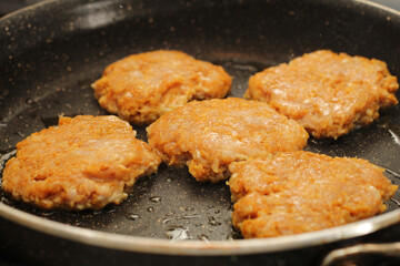 Chicken Kofta Patties Cooking on Hot Skillet