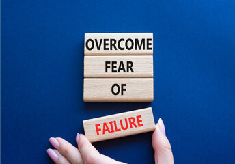 Fear of failure symbol. Concept words Overcome Fear of failure on wooden blocks. Beautiful deep...