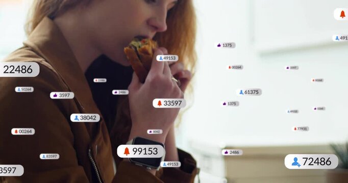 Woman resting smartwatch viewing animated alerts appearing around tablet, peeling wrapper for snack