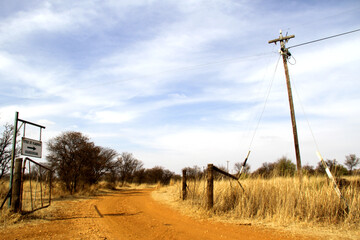 Photo of a farm gate with the farm name on the way to Krugerskraal. Paul Kruger's parents' farm and where Totius lived in seclusion to translate the Bible