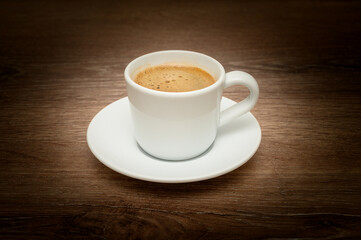 Side view of Turkish coffee with creamy foam in cup