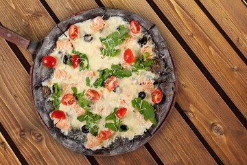 Tasty fresh hot pizza dish on desk