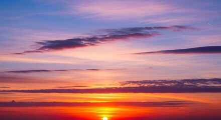 Obraz premium Vibrant Sunset Sky with Colorful Cloudscape.