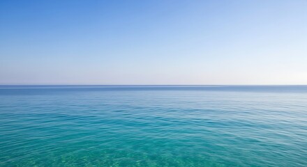 Obraz premium Serene Ocean Horizon Under Clear Blue Sky.