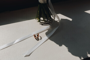 Wedding Rings with Bouquet Shadows