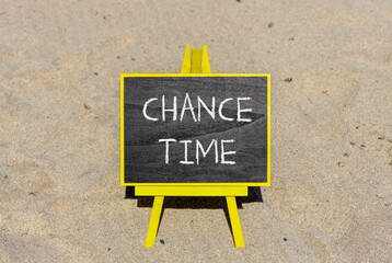 Chance time symbol. Concept word Chance time on beautiful black blackboard. Beautiful sand beach...