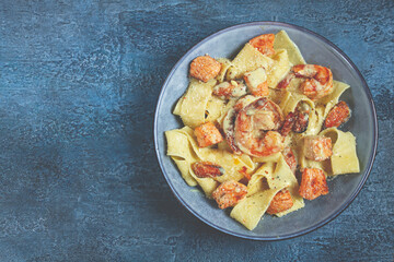 papardelle pasta in creamy sauce with seafood, homemade, no people,