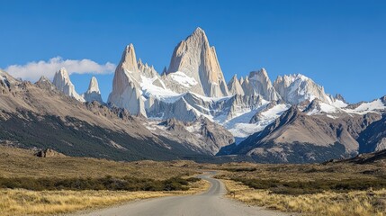 Majestic Fitz Roy Mountain Range Peaks Under a Clear Blue Sky with Winding Road