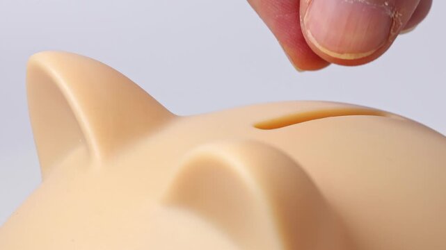 Close up view of man hands, piggy bank, Bulgarian lev coins stotinka. Concept of saving money for retirement, cash settlement, financial goals, success, literacy and income planning in Bulgaria.