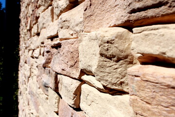 Stone wall texture close-up
Detailed close-up of a decorative stone wall with natural colors and textures. Perfect for use as a background, design element, or architectural concept.