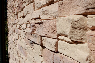 Stone wall texture close-up
Detailed close-up of a decorative stone wall with natural colors and textures. Perfect for use as a background, design element, or architectural concept.