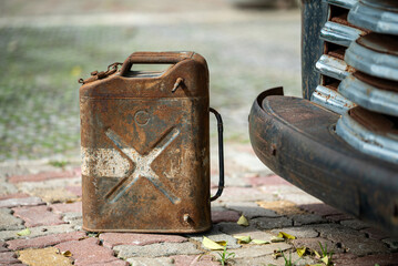 Vintage Metal Gas Can Near Classic Car