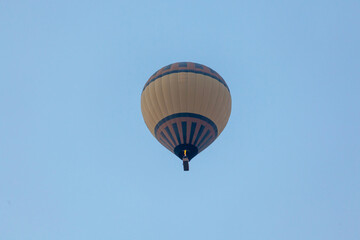 Three hot air balloon against a blue sky. Beautiful view of colourful hot air balloons from below. Cappadocia